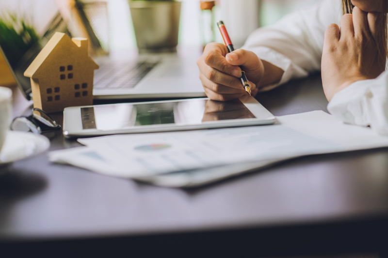 man writing on the tablet